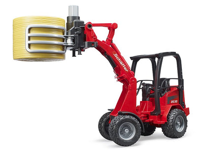 Bruder - Schäffer Hoflader 2630 mit Ballengreifzange + 1 Rundballen