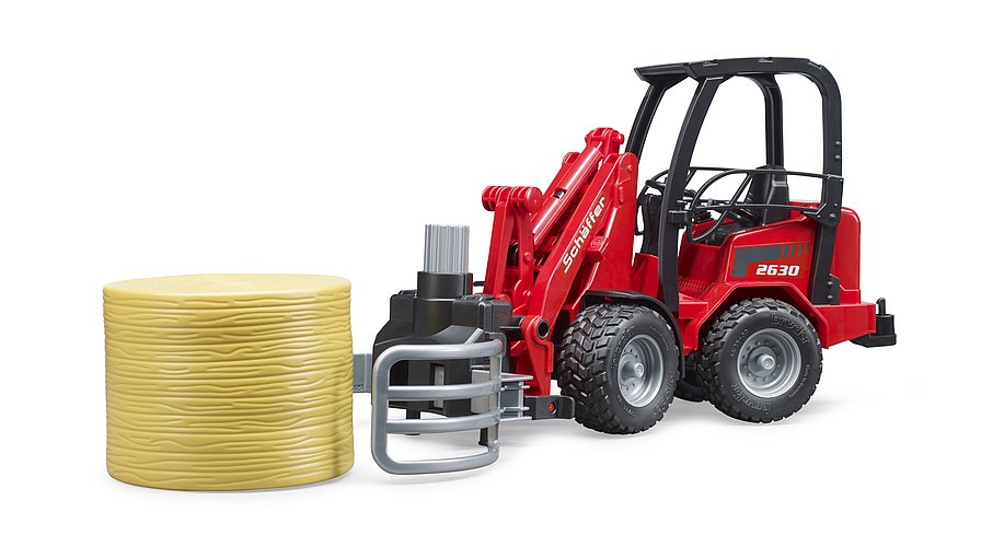 Bruder - Schäffer Hoflader 2630 mit Ballengreifzange + 1 Rundballen